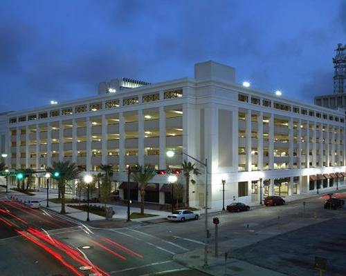 Exterior photo of City of Jacksonville parking garage at dusk.